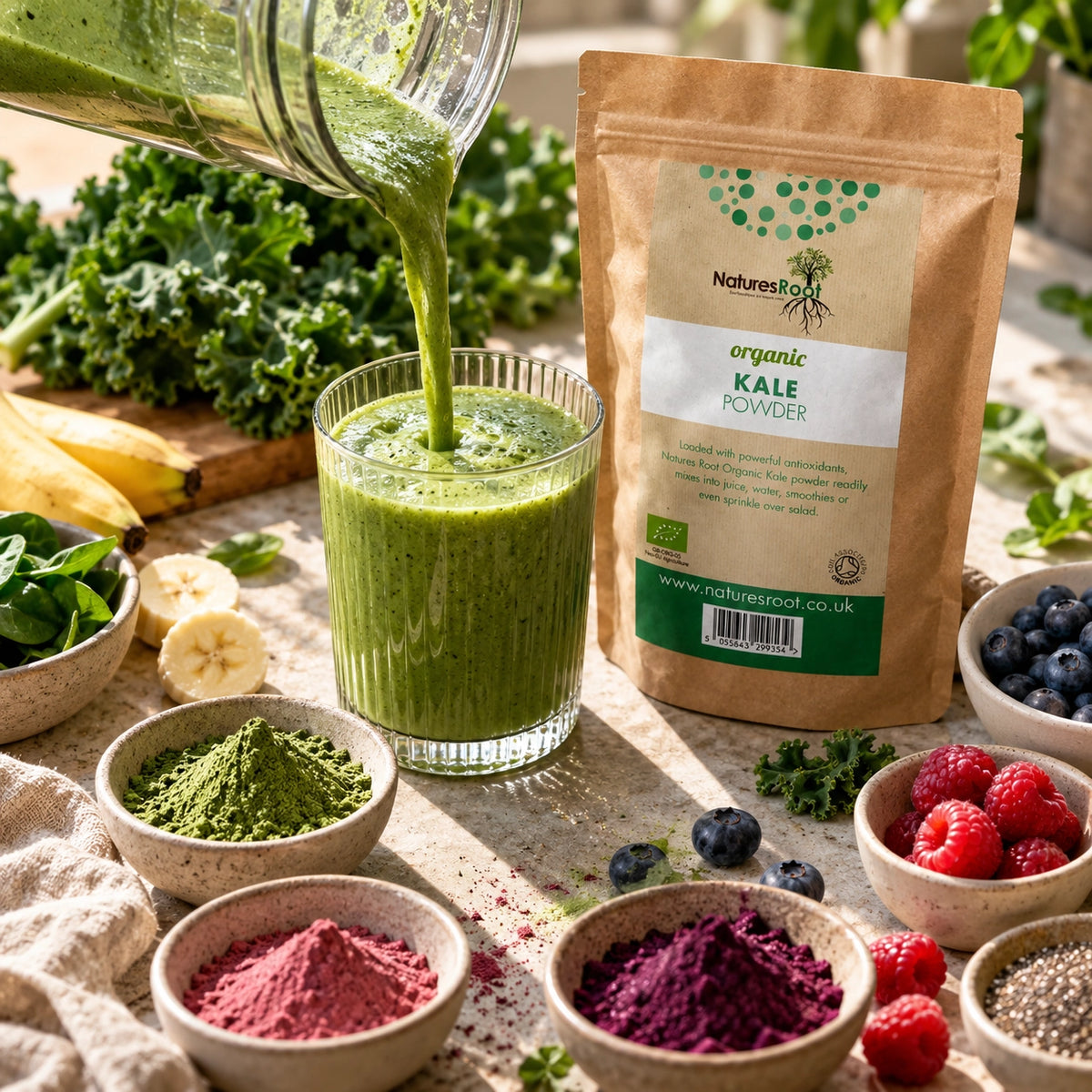 Green smoothie being poured beside a Nature's Root organic kale powder pouch