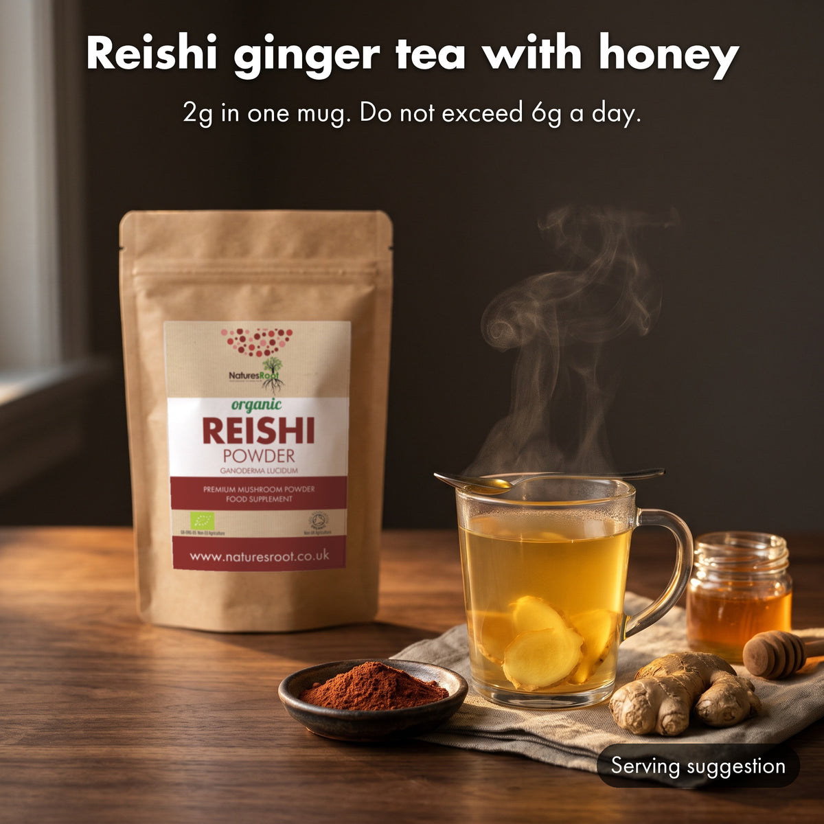 Ginger tea with fresh ginger and honey in a glass mug, with a reishi powder pouch behind. Serving suggestion.