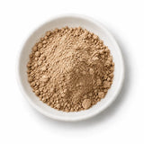 Organic Triphala Powder in a white dish