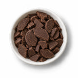 Organic Cacao Liquor in a white dish
